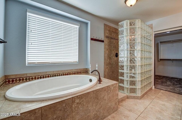 bathroom with tile patterned floors and plus walk in shower