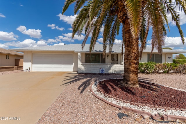 ranch-style house featuring a garage