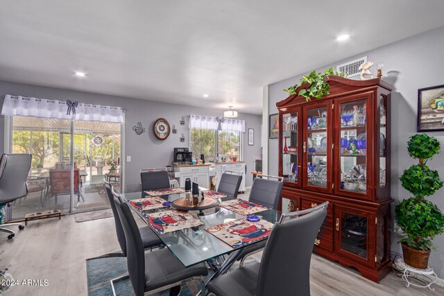 dining room with light hardwood / wood-style flooring