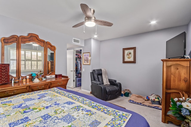 bedroom with light carpet and ceiling fan