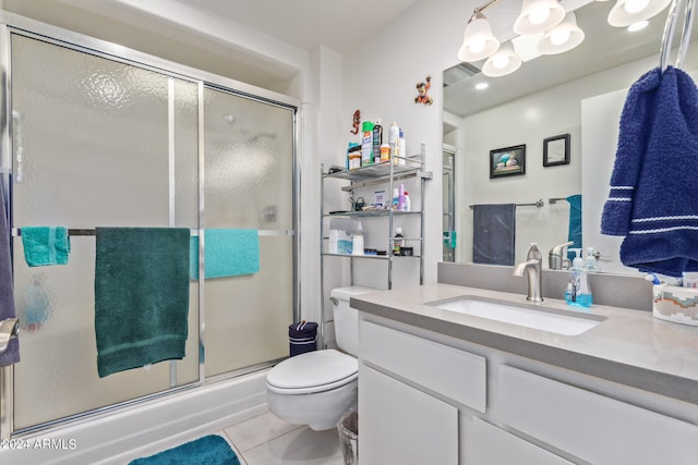 bathroom featuring vanity, toilet, and tile patterned floors