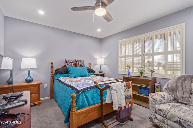 bedroom with ceiling fan and carpet flooring