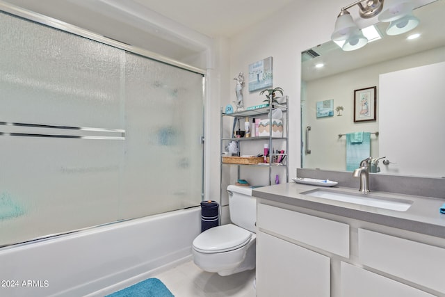 full bathroom with vanity, tile patterned flooring, toilet, and combined bath / shower with glass door