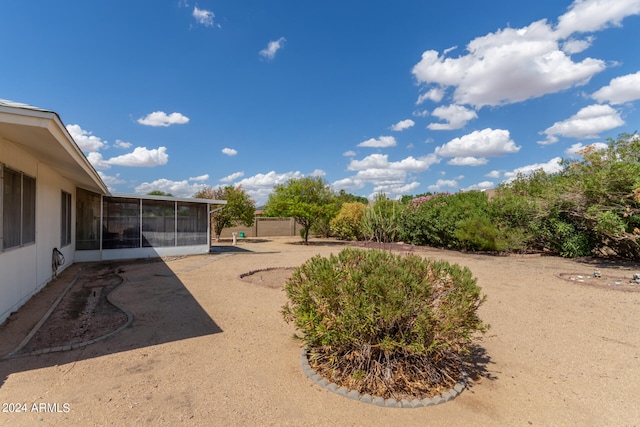 view of yard with a sunroom