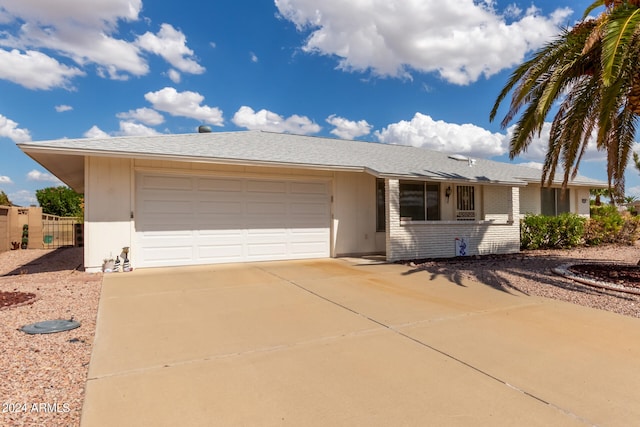 ranch-style home featuring a garage