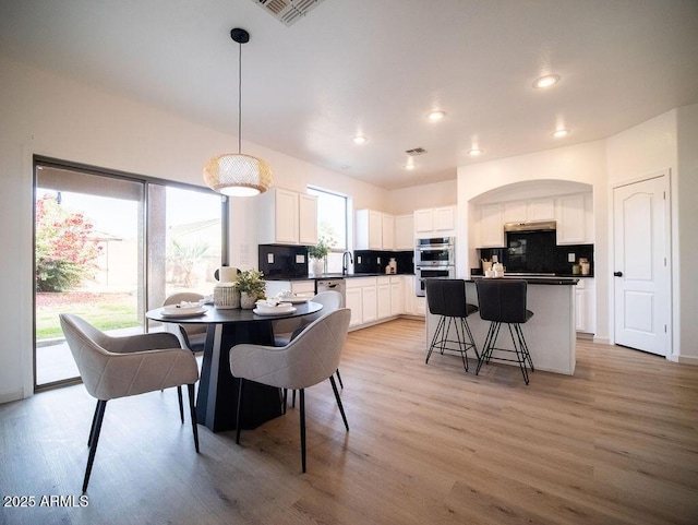 dining room featuring light wood-type flooring