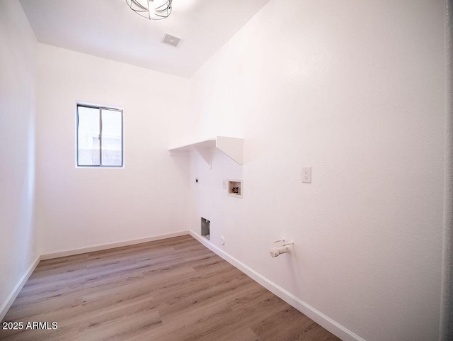 laundry room with electric dryer hookup, hookup for a gas dryer, washer hookup, and light wood-type flooring