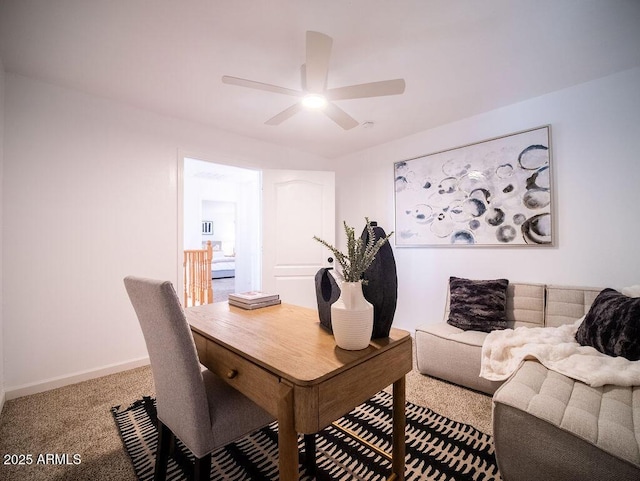 home office featuring carpet and ceiling fan