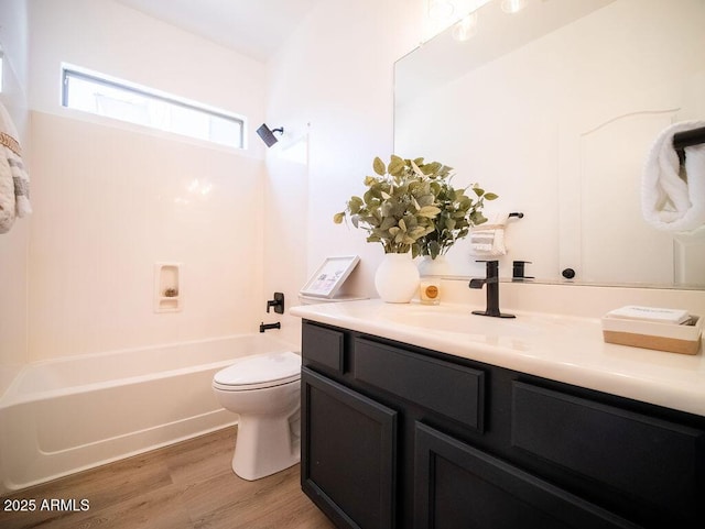 full bathroom featuring wood-type flooring, vanity, toilet, and shower / bathtub combination