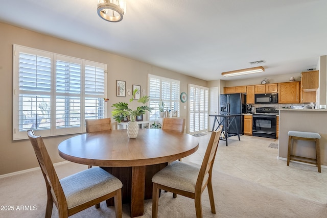 view of tiled dining space