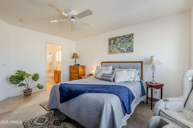 bedroom featuring connected bathroom and ceiling fan