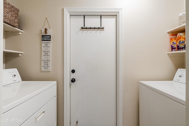 laundry room with washer and dryer