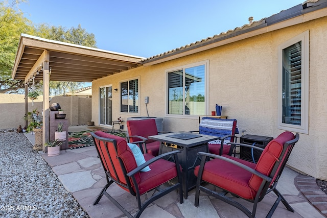 view of patio / terrace with an outdoor fire pit