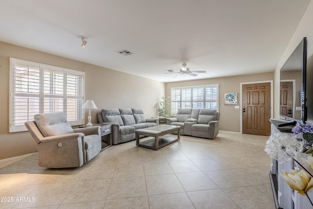 living room featuring ceiling fan and light tile patterned flooring