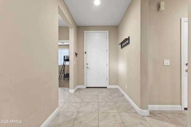 25969 W Tina Ln, Buckeye, AZ 85396 - entryway with light tile patterned floors and baseboards