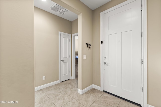 25969 W Tina Ln, Buckeye, AZ 85396 - foyer featuring light tile patterned flooring and baseboards