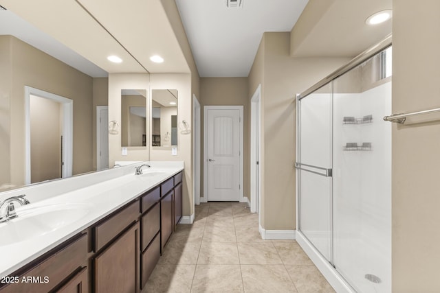 25969 W Tina Ln, Buckeye, AZ 85396 - full bathroom with double vanity, recessed lighting, and a shower stall