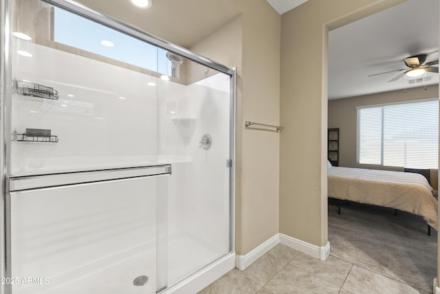25969 W Tina Ln, Buckeye, AZ 85396 - bathroom featuring a shower stall, ensuite bath, ceiling fan, tile patterned floors, and recessed lighting
