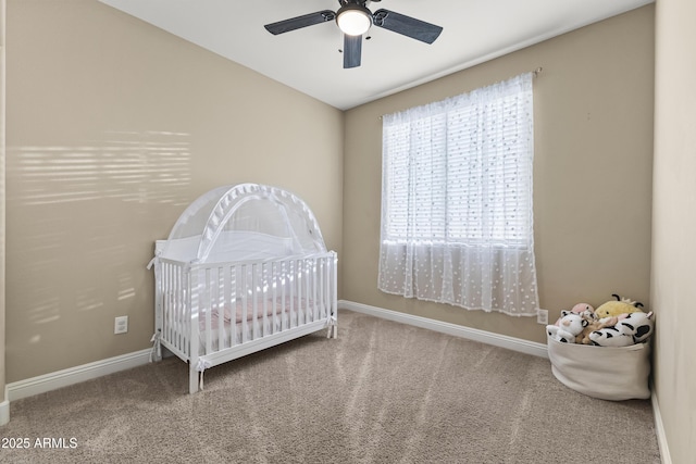 25969 W Tina Ln, Buckeye, AZ 85396 - carpeted bedroom with a crib, a ceiling fan, and vaulted ceiling
