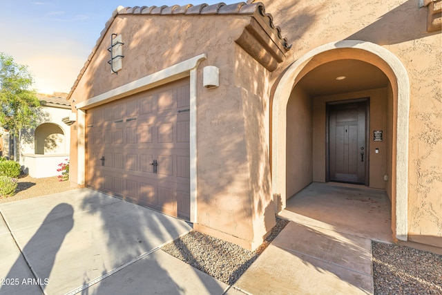 25969 W Tina Ln, Buckeye, AZ 85396 - property entrance featuring concrete driveway, stucco siding, and a tile roof