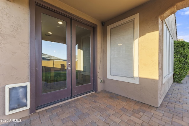 25969 W Tina Ln, Buckeye, AZ 85396 - entrance to property with stucco siding, french doors, and a patio