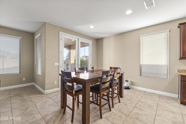25969 W Tina Ln, Buckeye, AZ 85396 - dining room with light tile patterned floors and recessed lighting