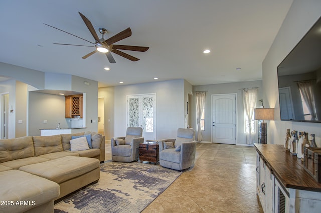 living room featuring recessed lighting, ceiling fan, baseboards, and light tile patterned floors