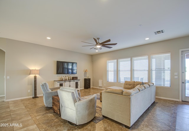 living area featuring recessed lighting, visible vents, ceiling fan, and baseboards