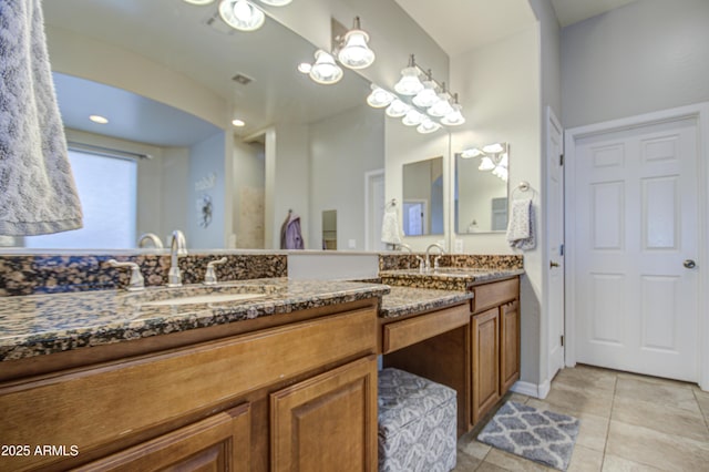 full bathroom featuring tile patterned flooring, a sink, and double vanity