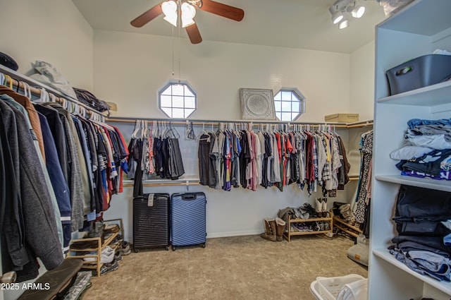 spacious closet with a ceiling fan