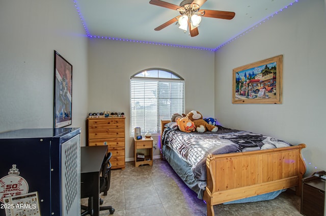 bedroom featuring light tile patterned floors, ceiling fan, and baseboards