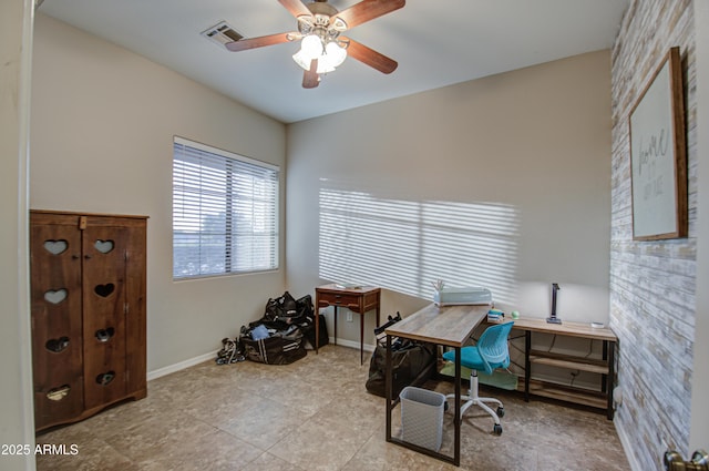 office featuring baseboards, visible vents, and ceiling fan