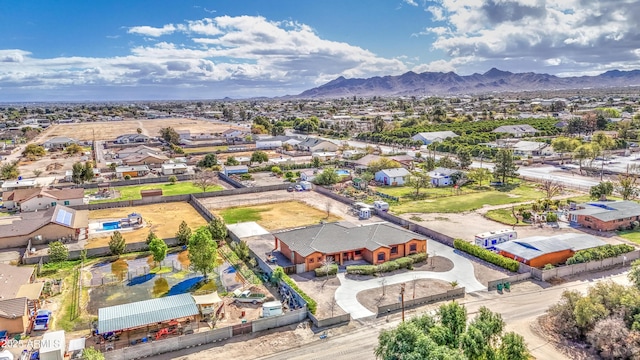 drone / aerial view featuring a residential view and a mountain view