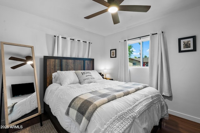 bedroom featuring dark wood-type flooring and ceiling fan