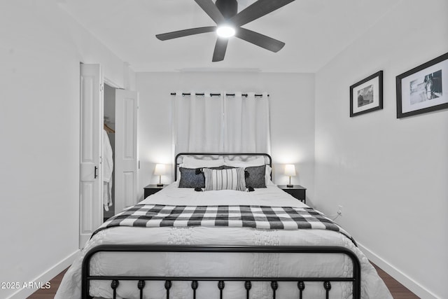 bedroom featuring ceiling fan and dark hardwood / wood-style flooring