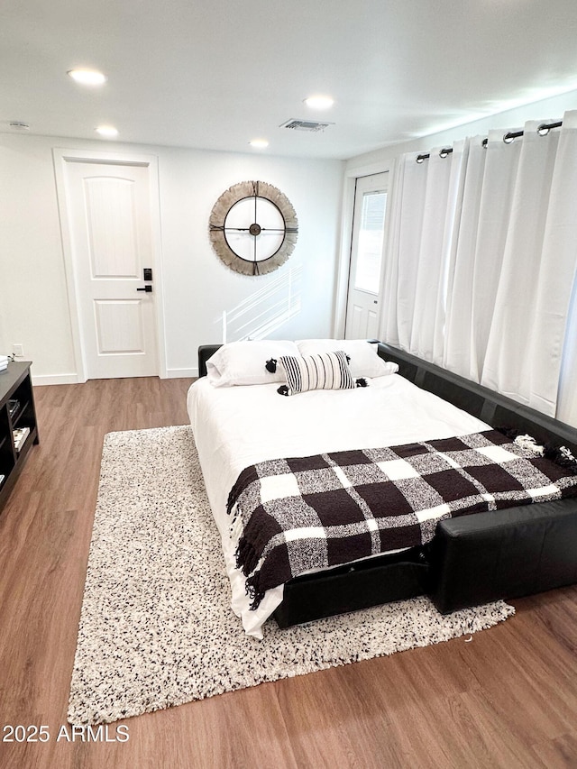 bedroom featuring hardwood / wood-style floors