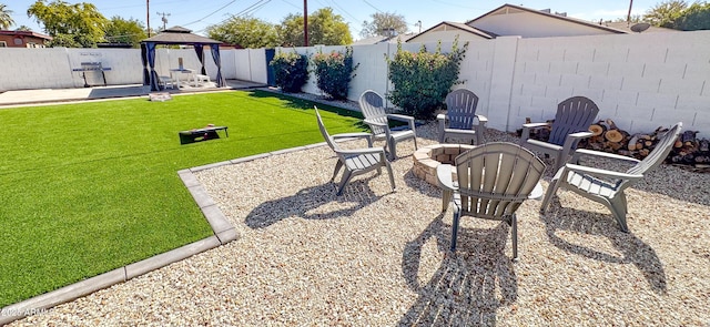 view of yard featuring a gazebo, a patio, and a fire pit