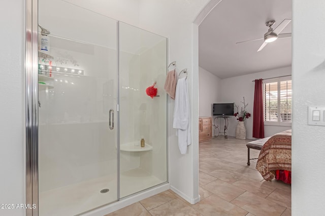 bathroom featuring tile patterned floors, a shower stall, a ceiling fan, and ensuite bathroom