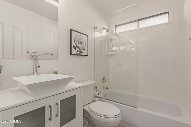 full bathroom featuring shower / bath combination with glass door, vanity, and toilet