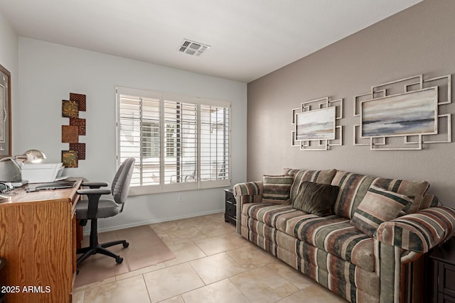 office area with baseboards, visible vents, and tile patterned floors