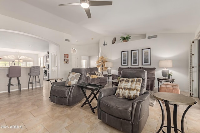 living room with vaulted ceiling, arched walkways, visible vents, and a ceiling fan