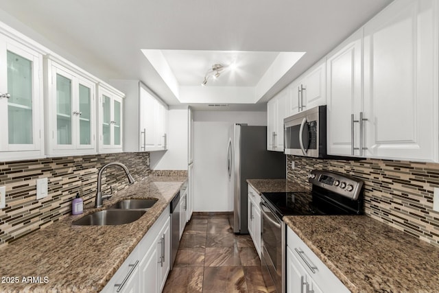 714 E Morningside Dr, Phoenix, AZ 85022 - kitchen with a tray ceiling, a sink, backsplash, appliances with stainless steel finishes, and white cabinets