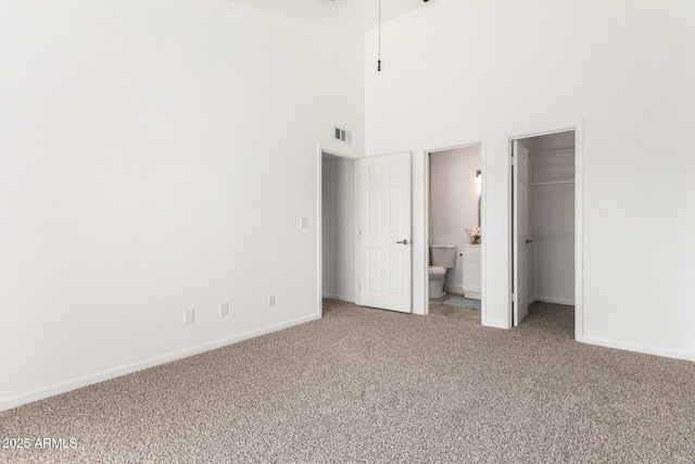 714 E Morningside Dr, Phoenix, AZ 85022 - unfurnished bedroom featuring light carpet, baseboards, visible vents, and a spacious closet