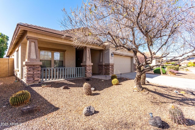 view of front of home featuring a garage and covered porch