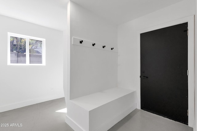 mudroom featuring concrete floors