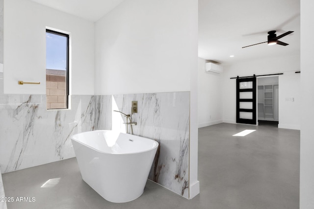 full bath with a wall mounted air conditioner, a freestanding tub, finished concrete flooring, and ceiling fan