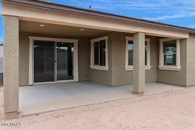 back of property featuring a patio area