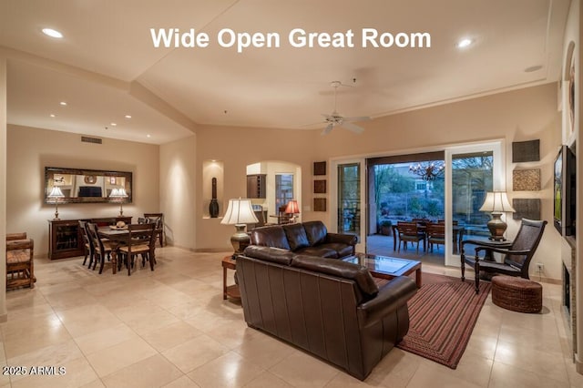 tiled living room with ceiling fan