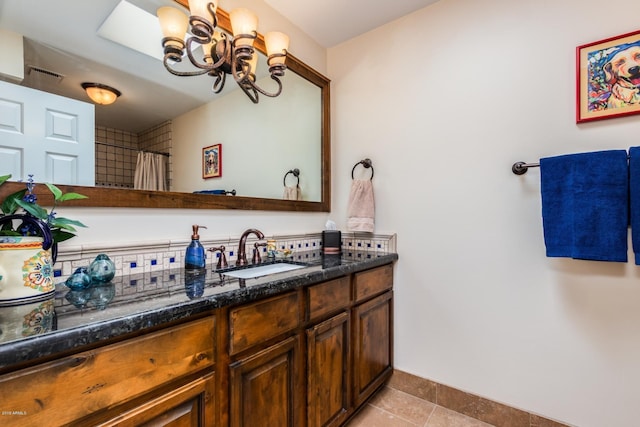 full bath with visible vents, a chandelier, a shower with curtain, tile patterned floors, and vanity