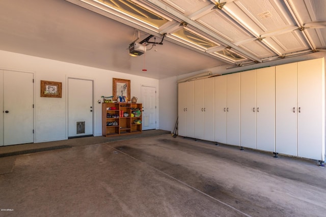 garage featuring a garage door opener